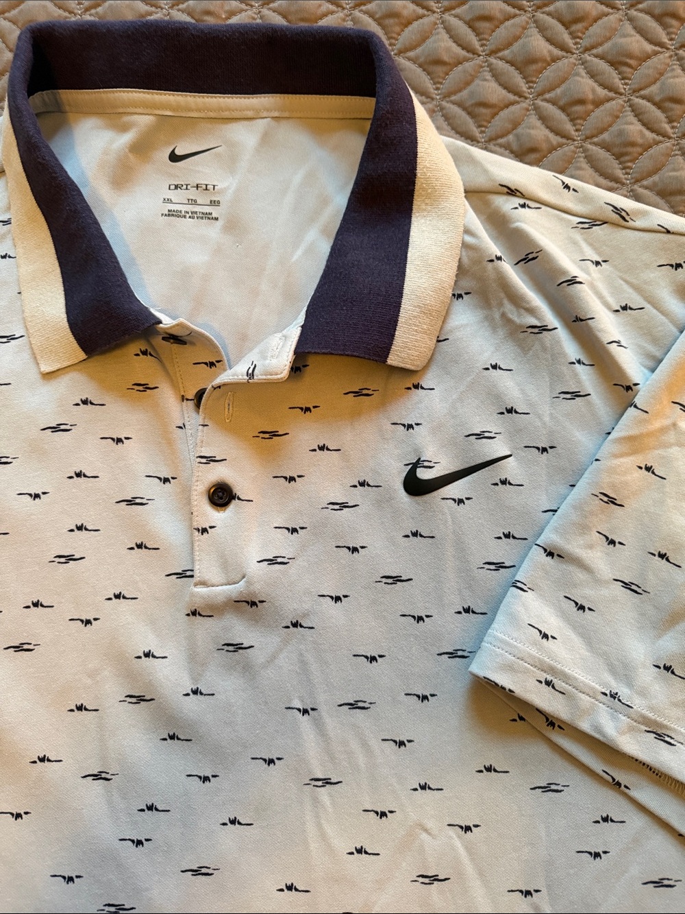 Nike Men’s light blue Golf Club Polo with dark blue collar and blue swoosh